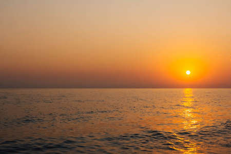 Sunset at sea. Variety of colors and hues of the rising sun.の写真素材