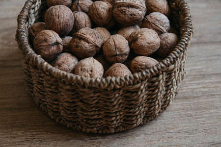 Element of a round wicker basket on a wooden background. Pattern of round texture. Top view. Copy, empty space for textの写真素材