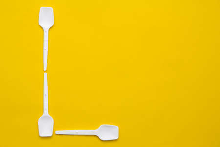 Silver foil on yellow background. Top view. Copy, empty space for text.の写真素材