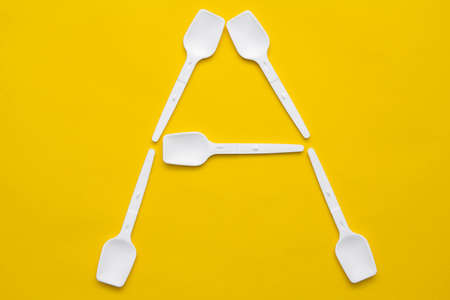 Silver foil on yellow background. Top view. Copy, empty space for text.の写真素材