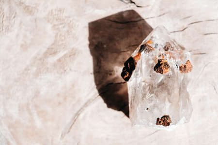 Amethyst polished crystal point on wooden background. Top view. Copy, empty space for text.の写真素材