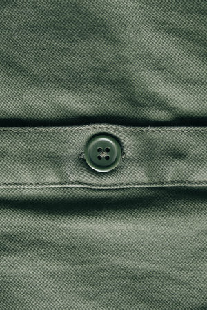 Texture of gray knitted material as background image. Knitting on the knitting needles. Top view....