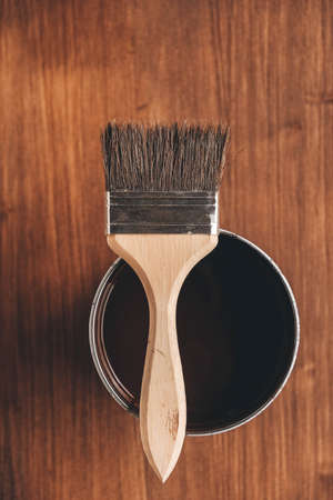 Paint brushes with a wooden handle and natural bristles on a wooden background. Repair concept. Copy, empty space for text.の写真素材