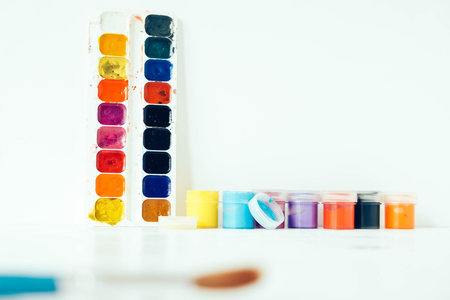 Watercolor paints on a white background. Copy, empty space for text.