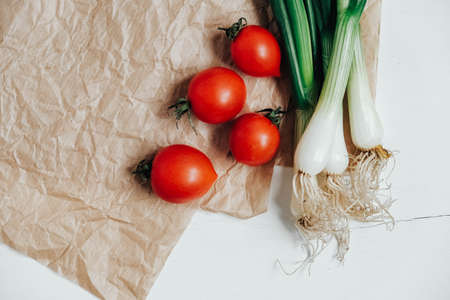 Set of different fresh vegetables on a white wooden table background. Top view. Copy, empty space for text.の写真素材