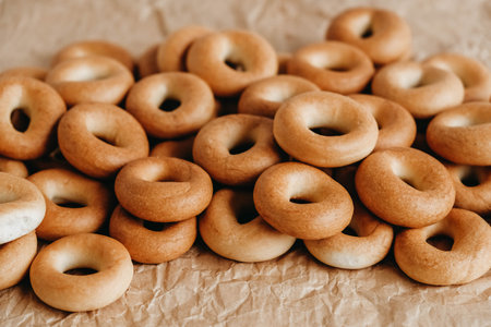 Drying or mini round bagels on a white wooden background. Copy, empty space for text.の写真素材