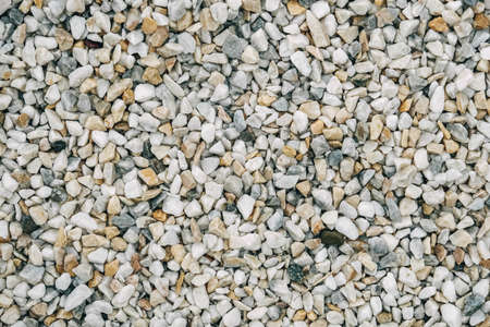 Texture of decorative stones or gravel as a background image. Top view. Copy, empty space for text.の写真素材