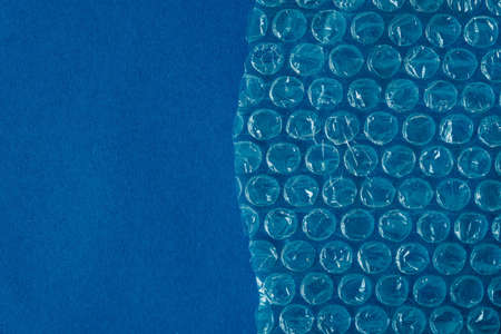 Packaging with air bubbles on a blue background.の写真素材