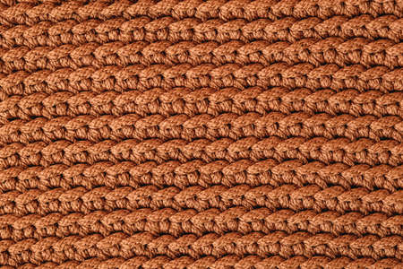 Brown knitted fabric texture background. Top view. Copy, empty space for text.の写真素材