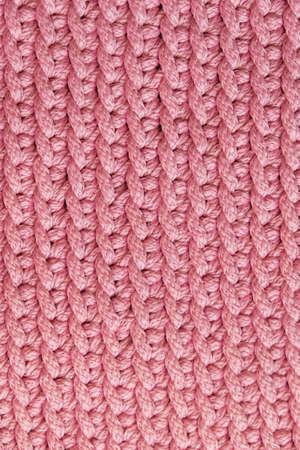 Pink knitted material texture background. Top view. Copy, empty space for text.の写真素材