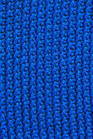 Blue knitted fabric texture background. Top view. Copy, empty space for text.の写真素材