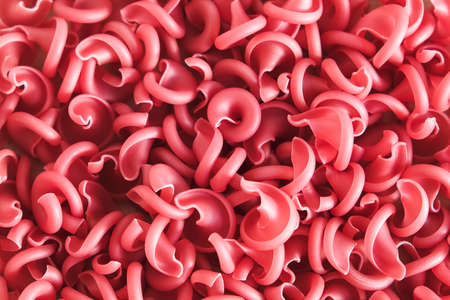 Red pasta as a background image. Top view. Copy, empty space for text.の写真素材