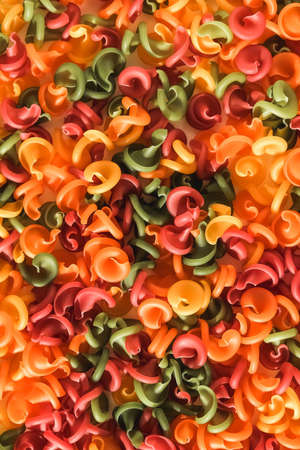 Multicolored pasta as a background image. Top view. Copy, empty space for text.の写真素材