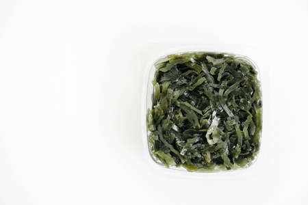 Seaweed in a plastic package on a white background. Top view. Copy, empty space for text.の写真素材