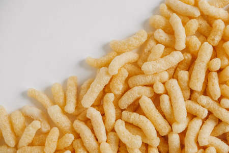 Corn sticks on a white background. Top view. Place for your text.の写真素材