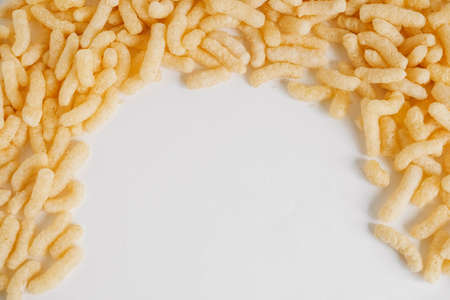 Corn sticks on a white background. Top view. Place for your text.の写真素材