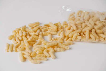 Corn sticks in a plastic bag on a white background. Top view. Copy, empty space for text.の写真素材