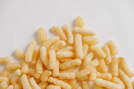 Corn sticks scattered on a white background. Top view. Place for your text.の写真素材