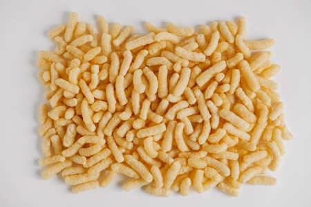 Corn sticks scattered on a white background. Top view. Place for your text.の写真素材