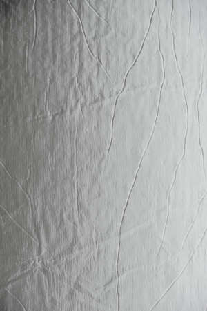 Aluminum silver foil as a background texture image. Top view. Copy, empty space for text.の写真素材