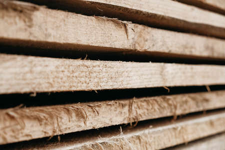 Wooden boards stacked on a pile as a background texture. Copy, empty space for text.の写真素材