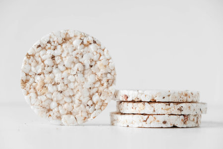 Round diet crispbreads on a white background. Round shaped cereal bread, healthy food without yeast. Copy, empty space for text.の写真素材