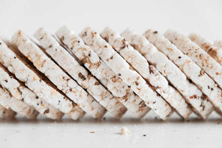 Round diet crispbreads on a white background. Round shaped cereal bread, healthy food without yeast. Copy, empty space for text.の写真素材