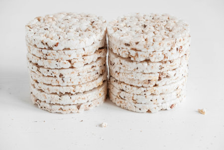 Round diet crispbreads on a white background. Round shaped cereal bread, healthy food without yeast....