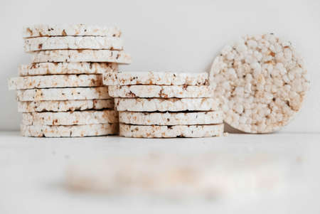 Round diet crispbreads on a white background. Round shaped cereal bread, healthy food without yeast. Copy, empty space for text.の写真素材