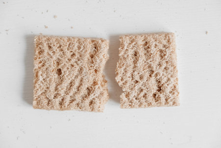 Rye crisp bread on a white wooden background. Top view. Copy, empty space for text.