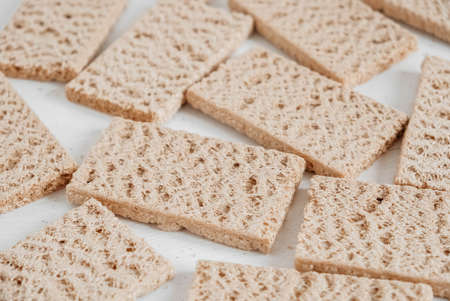 Rye crisp bread on a white wooden background. Top view. Copy, empty space for text.の写真素材