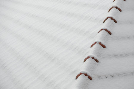 Snow covering the roof of the house. Copy, empty space for text.