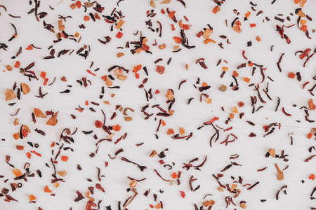 Dry fruit tea randomly scattered on a white table background. Top view. Copy, empty space for text.の写真素材