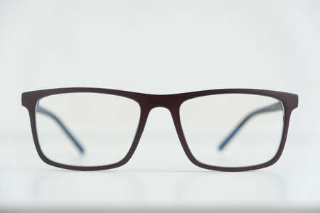 Optical glasses in a dark frame on a white background. Copy, empty space for text.の写真素材