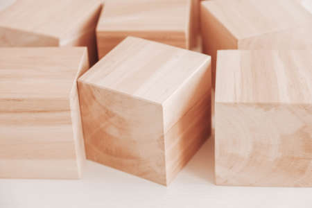Wooden cubes from natural wood on a white background. Copy, empty space for text.の写真素材