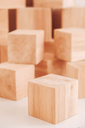 Stack wooden blocks from natural wood on a white background. Copy, empty space for text.の写真素材