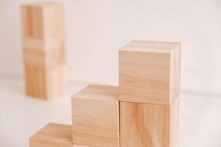 Stack wooden blocks from natural wood on a white background. Copy, empty space for text.の写真素材