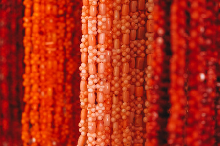 Red beads jewelry made of natural coral as a background texture. Copy, empty space for text.の写真素材
