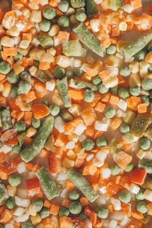 Mix of frozen vegetables as a background texture. Top view. Copy, empty space for text.の写真素材