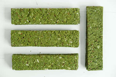 Crispy chips with kelp and spirulina on a white background.の写真素材