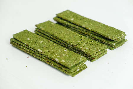 Crispy chips with kelp and spirulina on a white background.の写真素材
