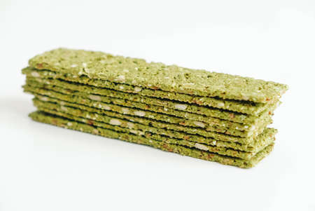 Crispy chips with kelp and spirulina on a white background.の写真素材