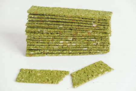 Crispy chips with kelp and spirulina on a white background.の写真素材