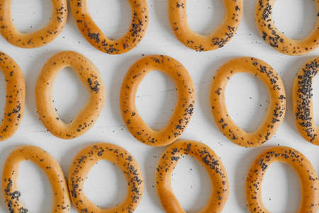 Dried bagels with poppy seeds on a white background.の写真素材