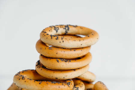 Dried bagels with poppy seeds on a white background.の写真素材