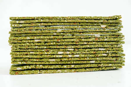 Crispy chips with kelp and spirulina on a white background.の写真素材