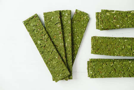 Crispy chips with kelp and spirulina on a white background.の写真素材