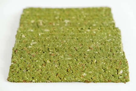 Crispy chips with kelp and spirulina on a white background.の写真素材