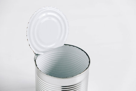 Empty open tin can on a white background.