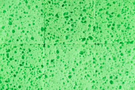 Green sponges for cleaning as a background texture.の写真素材